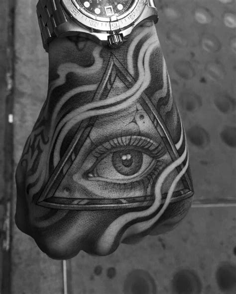 all seeing eye tattoo on hand